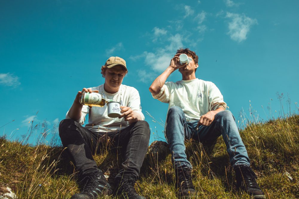 Friends sharing a dram on a Carlow hillside